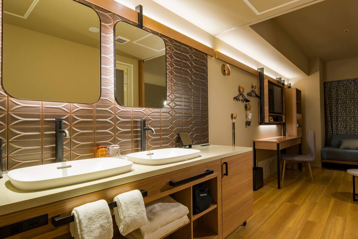 deluxe family room | 1 bedroom, in-room safe, blackout curtains, iron/ironing board