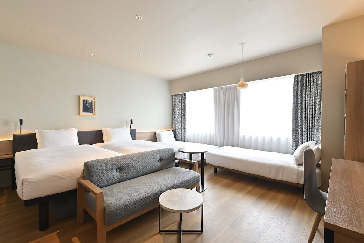 deluxe family room | 1 bedroom, in-room safe, blackout curtains, iron/ironing board