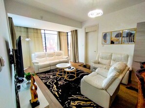 Executive Apartment | Living area | 20-inch Smart TV with digital channels, TV - Stay.Plus Stylish Living Nova (Nairobi)