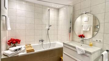 Bathtub, hair dryer, towels, soap