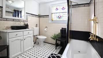 Combined shower/bathtub, hair dryer, towels, soap