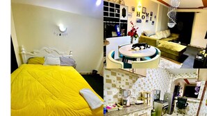 A hotel room with a bed, a dining area, a kitchen, a washing machine, and a bathroom. - Stay.Plus Kings & Queen's Apartment (Nairobi)