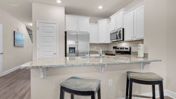 Coffee/tea maker, fridge, microwave, oven