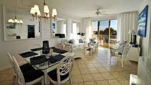 Living room - Ocean's Edge - Sip your coffee and watch the waves as you enjoy the gulf view balcony, accessible from the living room and the master bedroom 2 Condo by RedAwning (Dauphin Island)