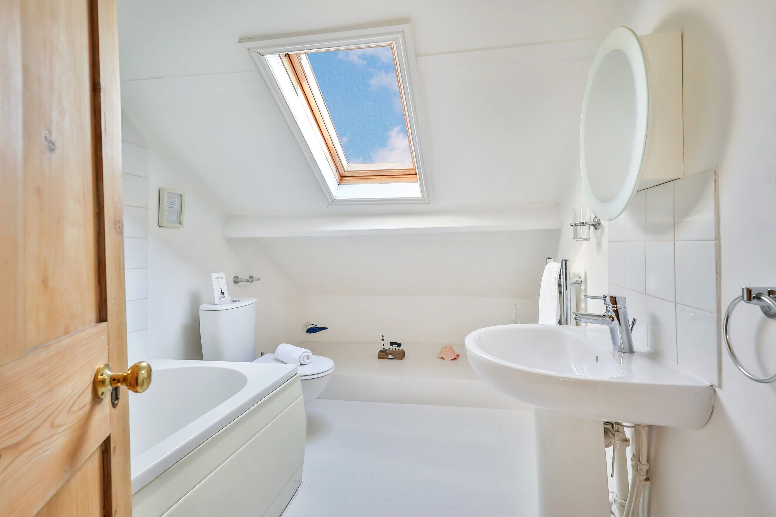 Bathtub, towels, soap, toilet paper