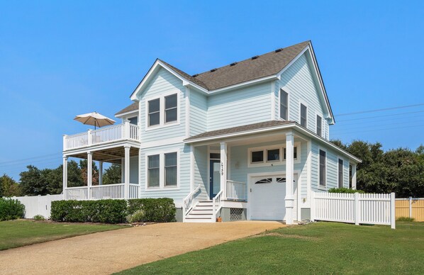 A two-story house with a porch, a covered front entrance, and a visible address number. - Boromacha: Private Pool, Hot Tub, Club Access (Corolla)