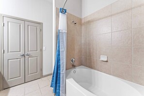 Shower, hair dryer, towels, shampoo