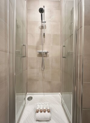 Shower, hair dryer, towels, soap