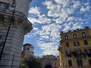 A historic building with classical architecture, including columns and a bell tower. - Colosseo Gardens - C13 (Rome)