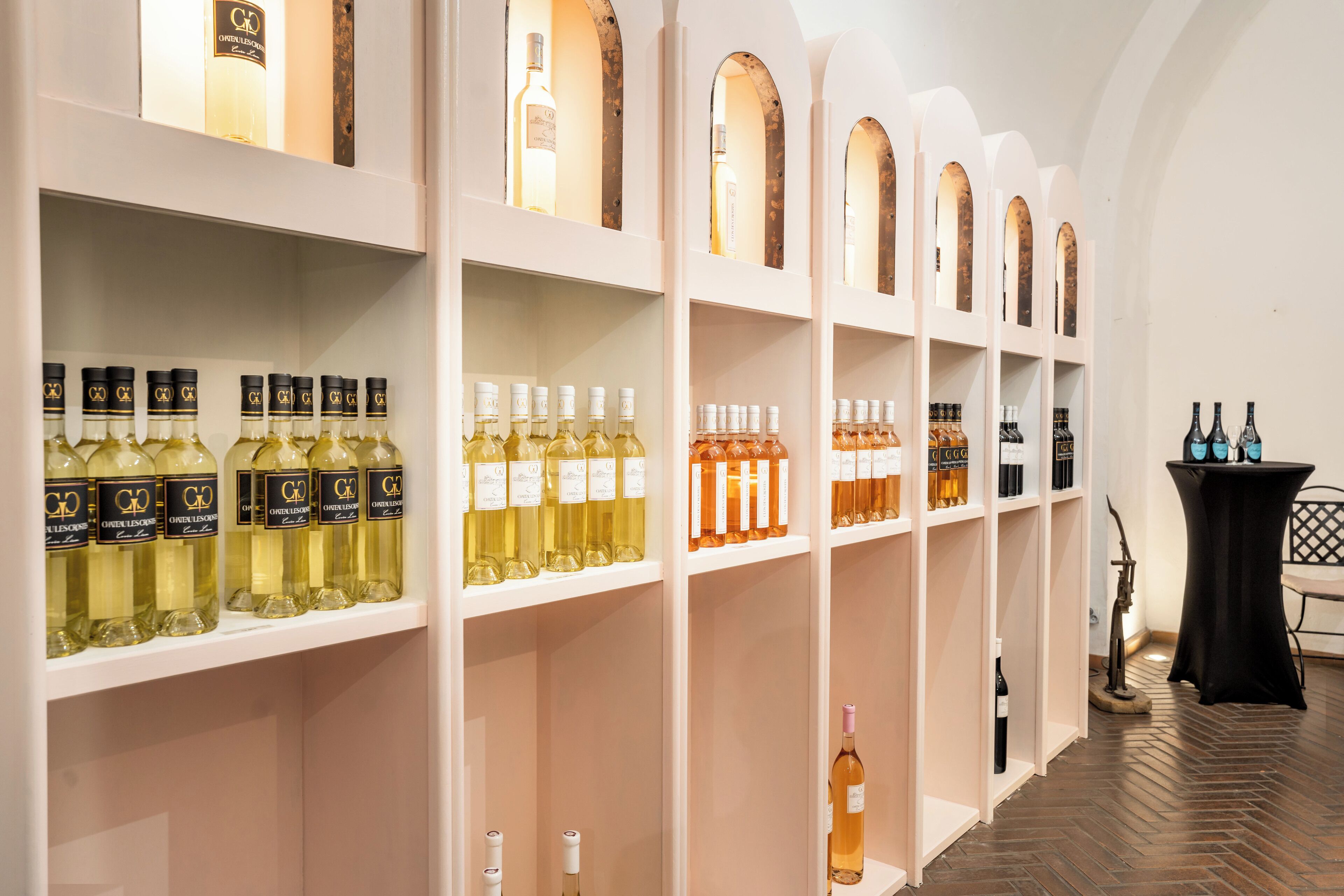 A wine cellar with shelves of various wine bottles.