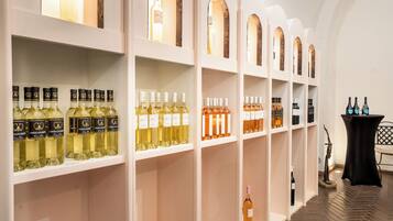 A wine cellar with shelves of various wine bottles.