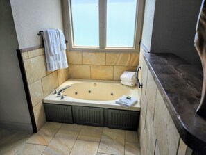 Bathtub, hair dryer, towels, soap