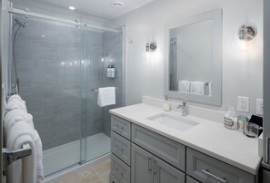 Combined shower/tub, hair dryer, towels, soap