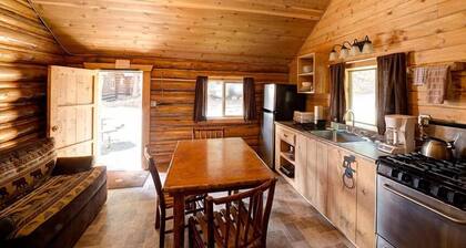 Comfy cabin is situated on the Silver Gate property which overlooks 10,000ft tall mountain peaks surrounding the town.