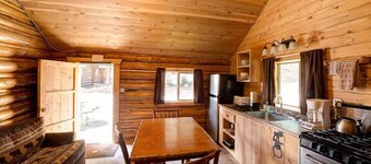 Comfy cabin is situated on the Silver Gate property which overlooks 10,000ft tall mountain peaks surrounding the town.