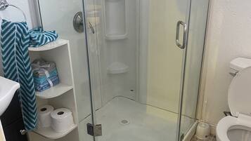 Shower, hair dryer, towels, soap