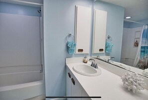 Combined shower/tub, hair dryer, towels, soap