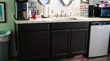 Fridge, microwave, coffee/tea maker, cookware/dishes/utensils