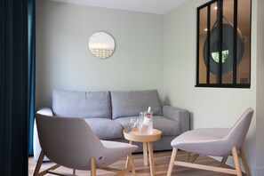 Chambre familiale | Lit avec matelas Select Comfort, coffre-fort, rideaux d’obscurcissement