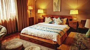 A bedroom with a wooden bed, two bedside tables, a wall-mounted air conditioner, and a window with curtains. - Fanhua Courtyard (Chongqing)