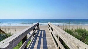 A wooden boardwalk leading to a beach with the ocean in the background. - Pets OK Beach Home+Short Walk Beach Access+Views! Recent Updates & Upgrades (Surf City)