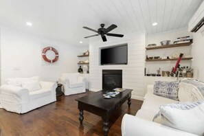 Living area - Updated Cabin with Fireplace, Epic Deck, 2 min from ORV trails - Pet Friendly!  (Mancelona)