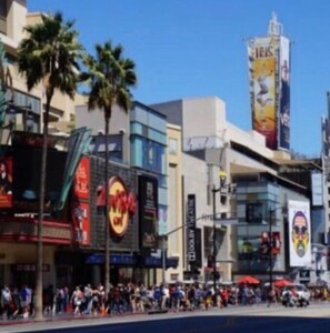 Experience the vibrant energy of the city, surrounded by a mix of shops and restaurants.