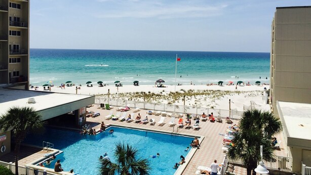 A pool area with a view of the beach and ocean. - Oceanfront condo in Pinnicle Port on the west end of Panama City Beach. (Panama City)