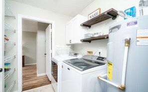 Convenient laundry facilities include a washing machine and dryer.