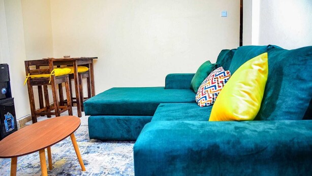 Business Apartment | Living area | 20-inch Smart TV with digital channels, TV - Stay.Plus TRM Business Apartments (Nairobi)
