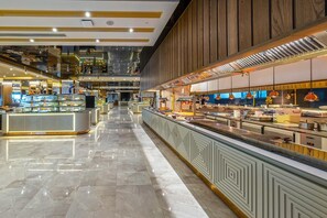 A spacious, well-lit food court with multiple counters and a polished marble floor. - Lago Hotel Ex Azura Deluxe Resort and Aqua Sorgun (Manavgat)