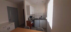 Microwave, stovetop, coffee/tea maker, toaster