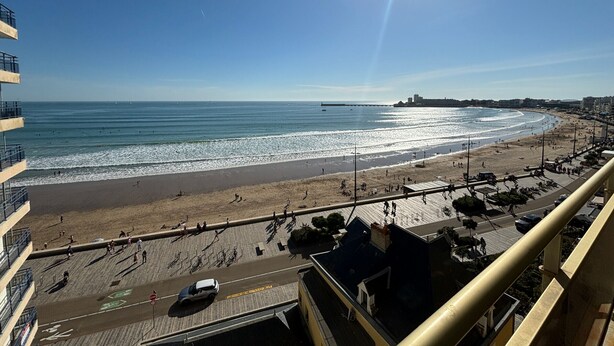 A coastal cityscape with a beach, promenade, and buildings. - Beachfront Apartment with Balcony, Sleeps 4, 2 Stars (Les Sables-d'Olonne)