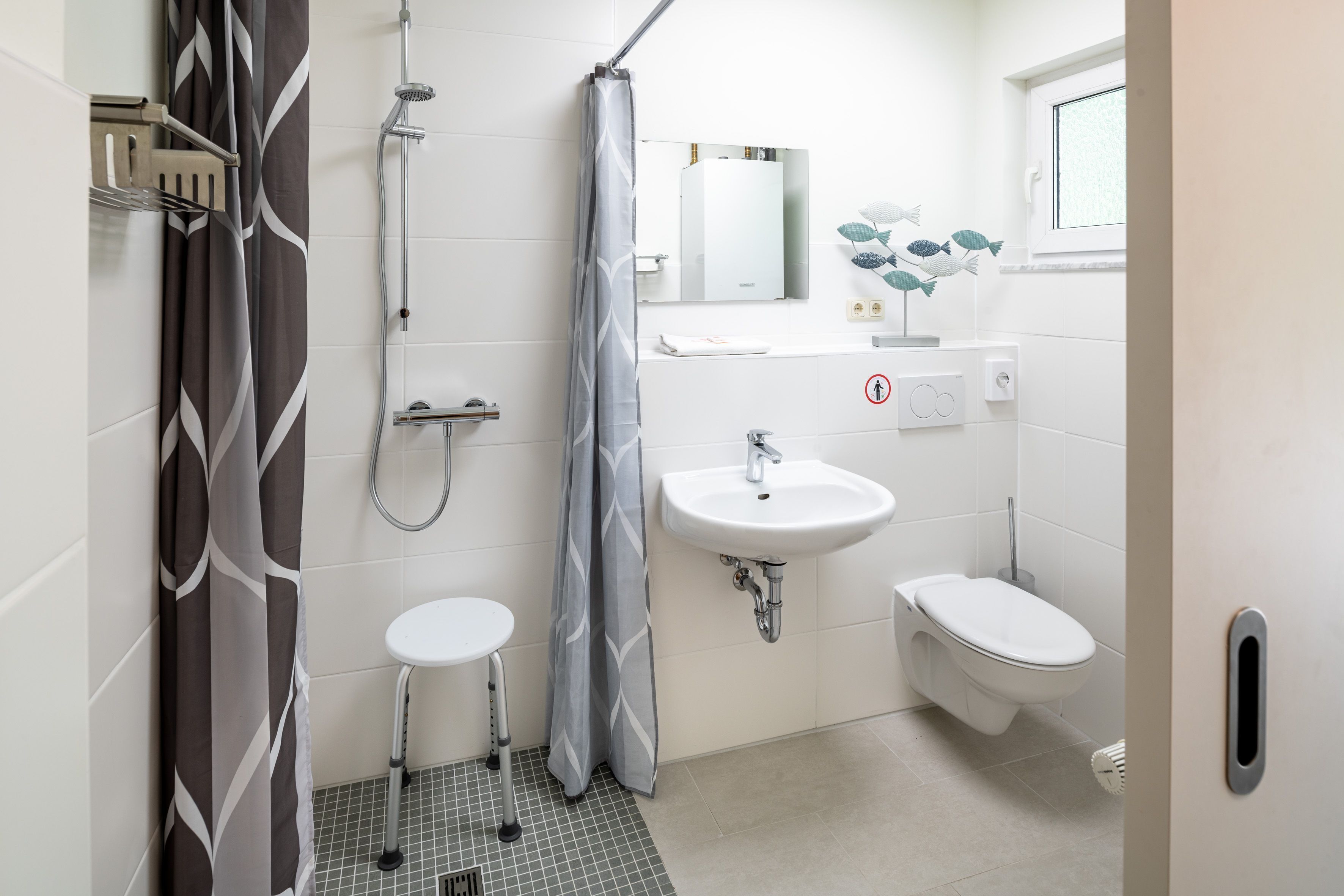 Shower, hair dryer, towels, toilet paper