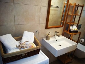 Bathtub, hair dryer, towels, soap