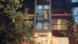 A modern building with a sign reading "ORCHID" at the top. - Hotel Orchid (Lucknow)