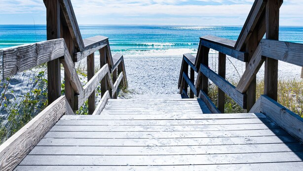 A wooden boardwalk leading to a beach with the ocean in the background. - Ariel Dunes I 1407 *Beach Access*3 pools* (Miramar Beach)