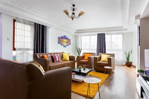 Luxury Apartment | Living area | 24-inch Smart TV with digital channels, TV - Stay.Plus Skyline Apartment Kilimani (Nairobi)