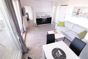 Deluxe Apartment, 1 Bedroom, Non Smoking, Pool Access | Living area | 45-inch flat-screen TV with satellite channels, TV