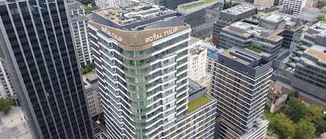 A high-rise building with the sign "ROYAL TULIP" on the top.