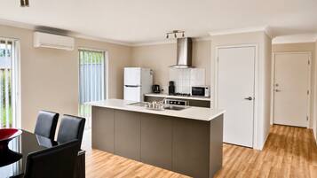 Microwave, oven, dining tables