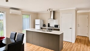 Microwave, oven, dining tables