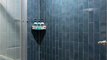 Shower, hair dryer, towels, shampoo