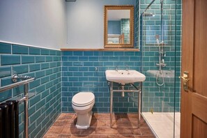 Shower, hair dryer, towels, shampoo