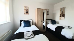 Departamento | 1 habitación, tabla de planchar con plancha, wifi gratis y ropa de cama 