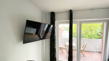 Estudio Deluxe, 1 cama doble, balcón | Zona de estar