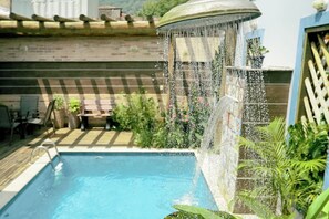 Outdoor pool, open 8:00 AM to 10:00 PM, pool loungers