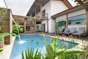 Outdoor pool, open 8:00 AM to 10:00 PM, pool loungers