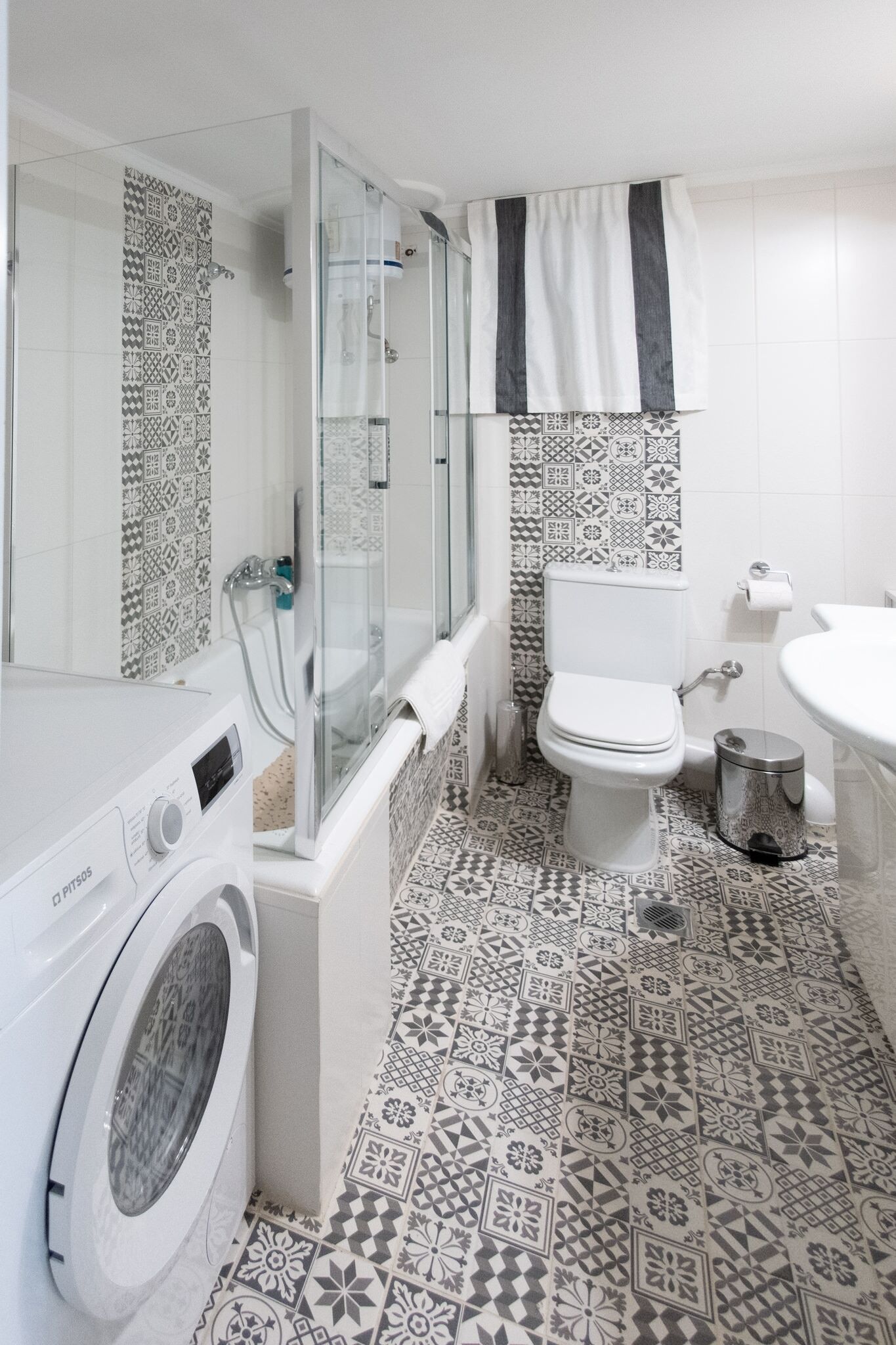 Bathtub, hair dryer, slippers, towels