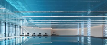 Indoor pool, open 9:00 AM to 9:00 PM, pool loungers, lifeguards on site